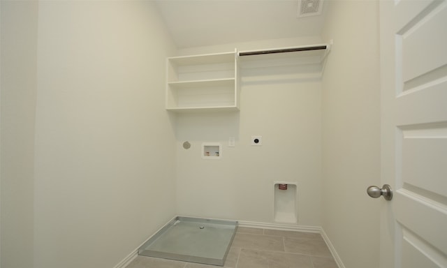 laundry area featuring electric dryer hookup, hookup for a gas dryer, light tile patterned floors, and washer hookup