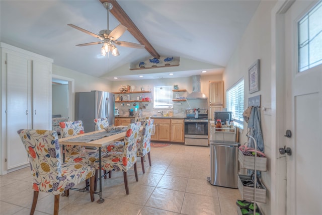 dining room featuring ceiling fan and lofted ceiling with beams