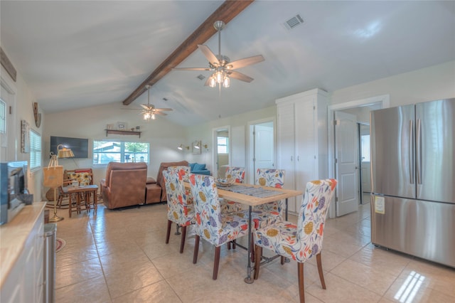 dining area featuring vaulted ceiling with beams, ceiling fan, and light tile patterned floors