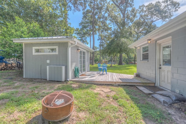 view of yard with a fire pit and a wooden deck