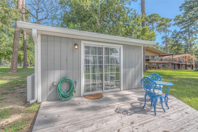 wooden deck with a lawn