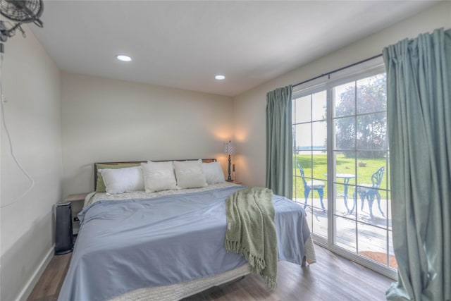 bedroom featuring access to outside and light hardwood / wood-style flooring