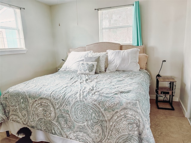 bedroom featuring tile patterned floors