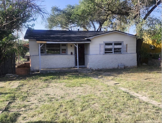 ranch-style house with a front yard