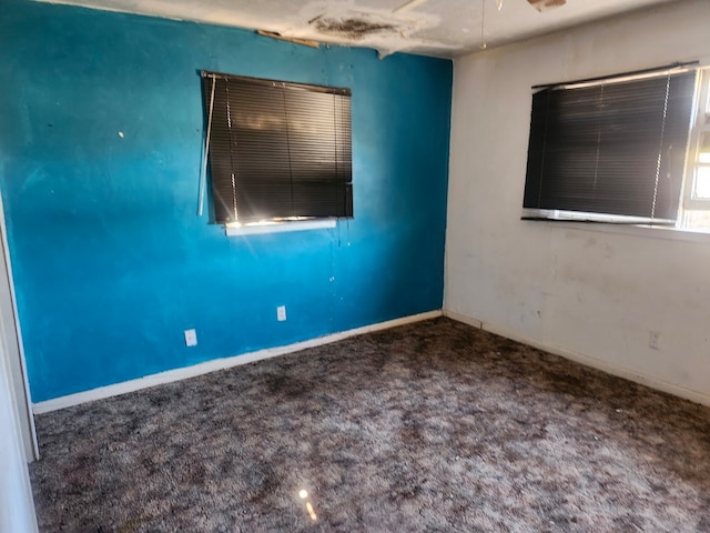 unfurnished room with carpet floors