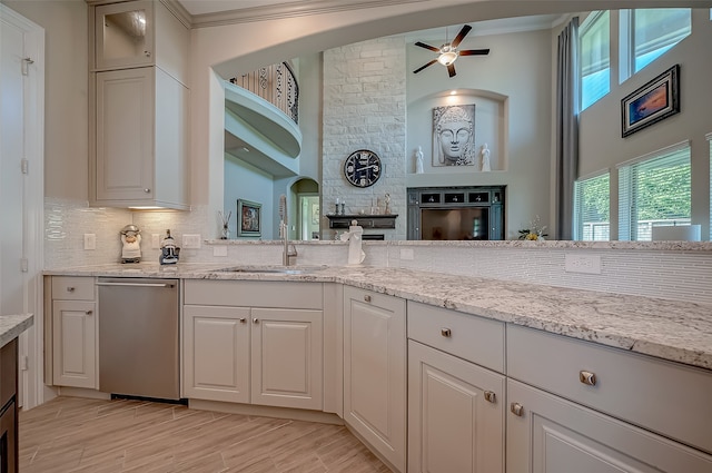 kitchen featuring dishwasher, ornamental molding, and white cabinetry