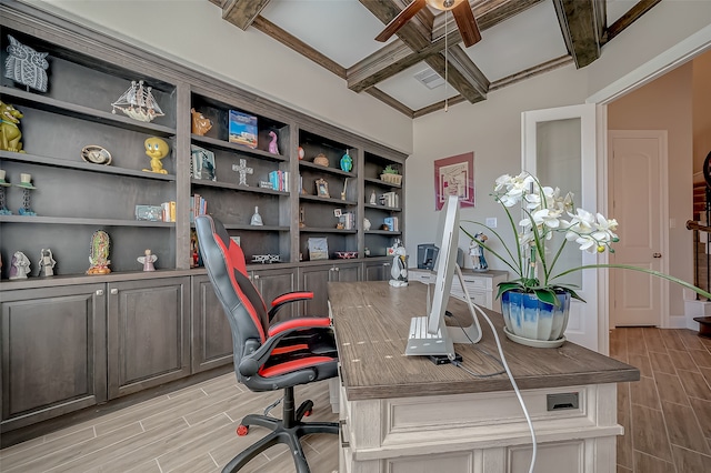 home office with light wood-type flooring and beamed ceiling