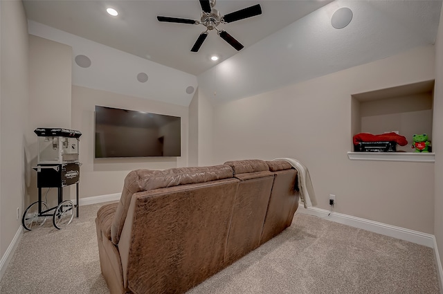 living room featuring ceiling fan, light colored carpet, and vaulted ceiling