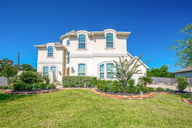 french country inspired facade featuring a front lawn