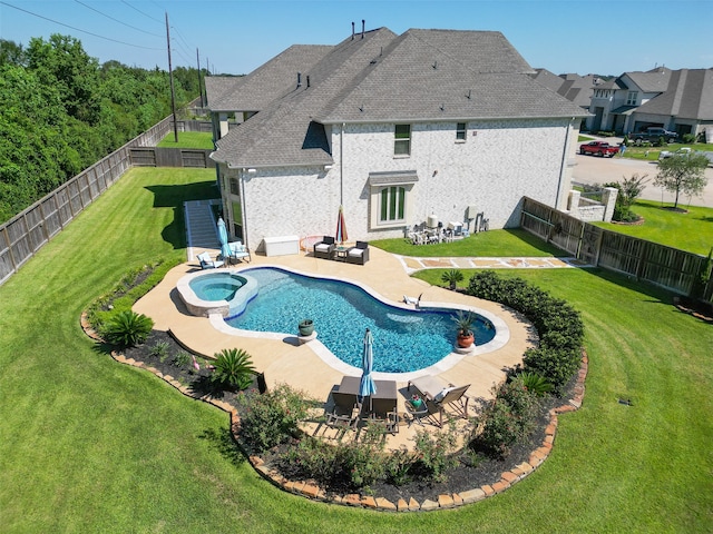 view of pool featuring a yard and a patio area