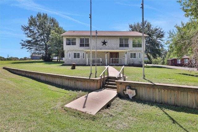 back of house featuring a yard