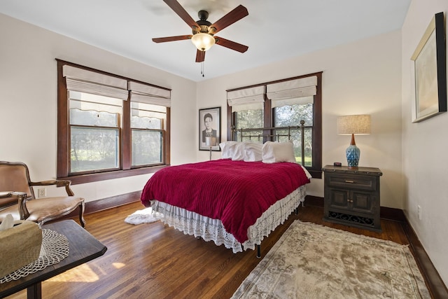 bedroom featuring ceiling fan and dark hardwood / wood-style flooring