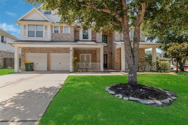 view of front of property featuring a garage and a front yard