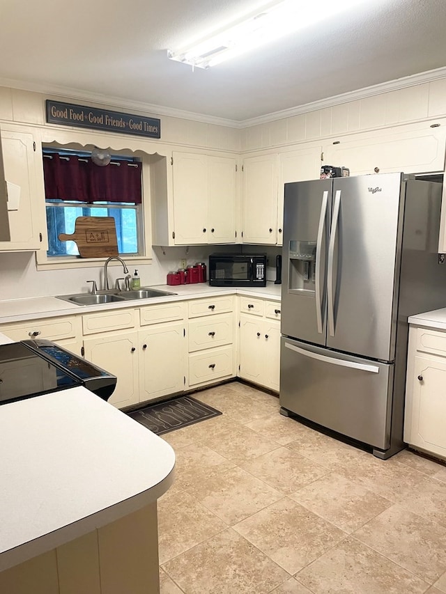 kitchen featuring ornamental molding, black appliances, and sink