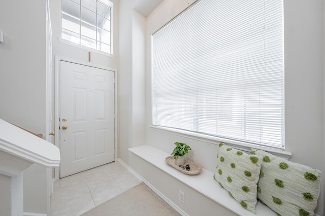 foyer featuring light tile patterned floors