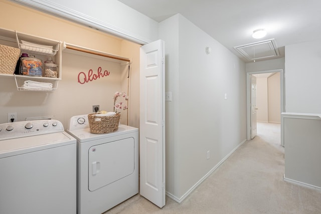 washroom featuring separate washer and dryer and light colored carpet