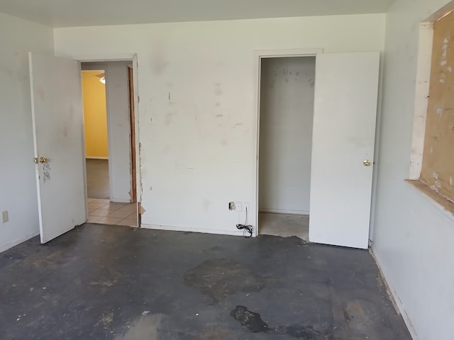 unfurnished bedroom with a closet