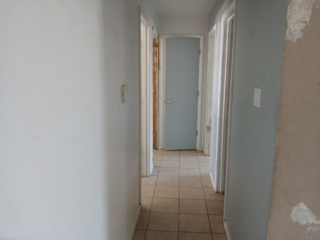 hallway featuring light tile patterned floors