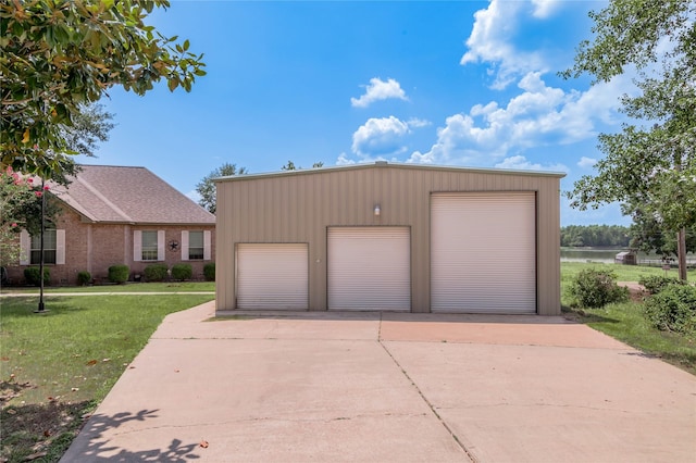 206 Lake Front Dr, Trinity, TX 75862 - detached garage featuring a water view