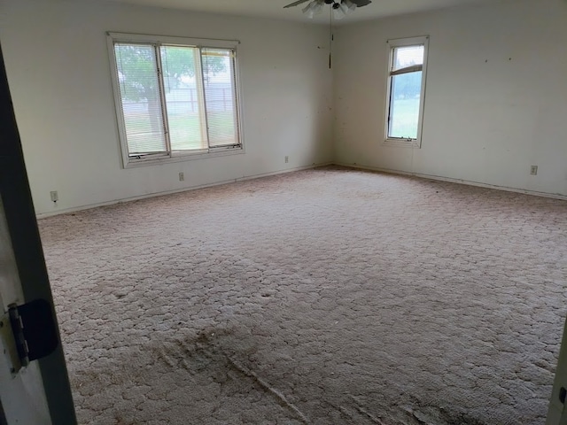 unfurnished room featuring carpet flooring and ceiling fan