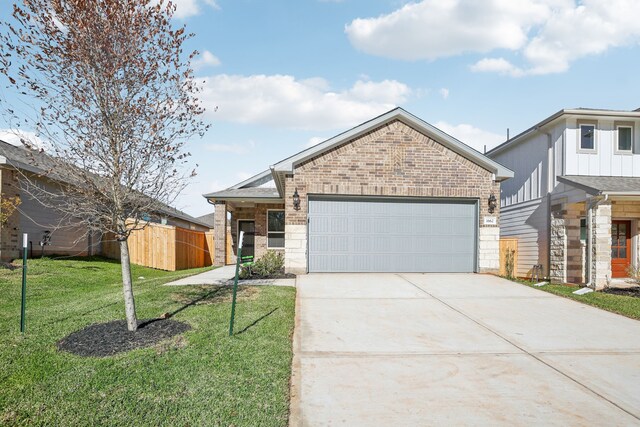 view of front facade featuring a front lawn and a garage