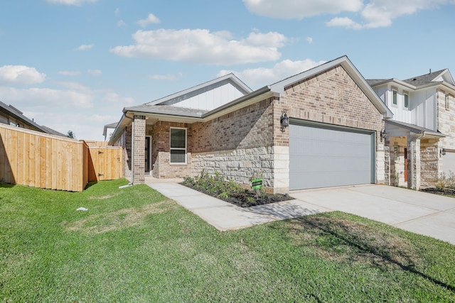 view of front of house with a front yard and a garage