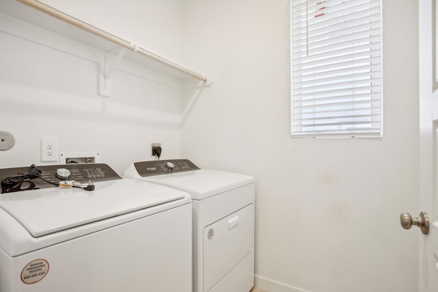 laundry room featuring washing machine and clothes dryer