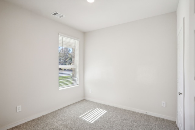 unfurnished room featuring carpet