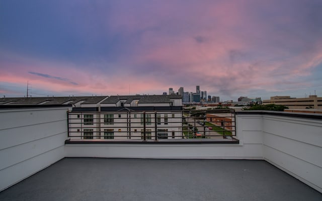 patio terrace at dusk with a balcony