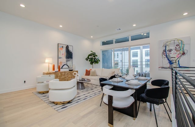 living room with light hardwood / wood-style floors