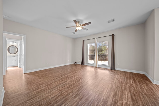 empty room featuring hardwood / wood-style flooring and ceiling fan