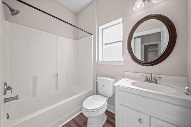 full bathroom featuring shower / bathing tub combination, vanity, hardwood / wood-style flooring, and toilet