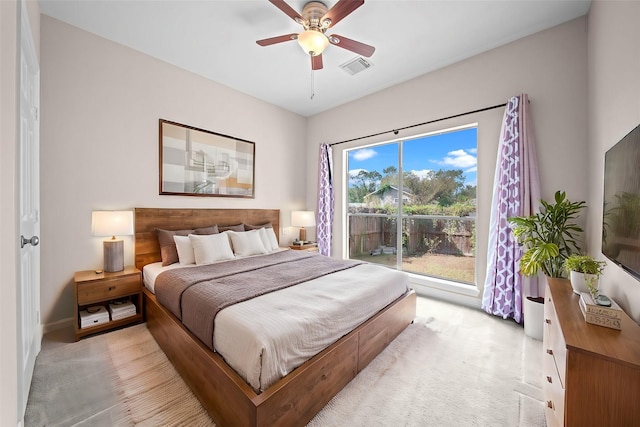 bedroom with ceiling fan and light carpet