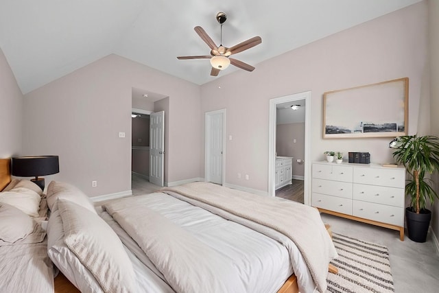 carpeted bedroom with ceiling fan, connected bathroom, and vaulted ceiling