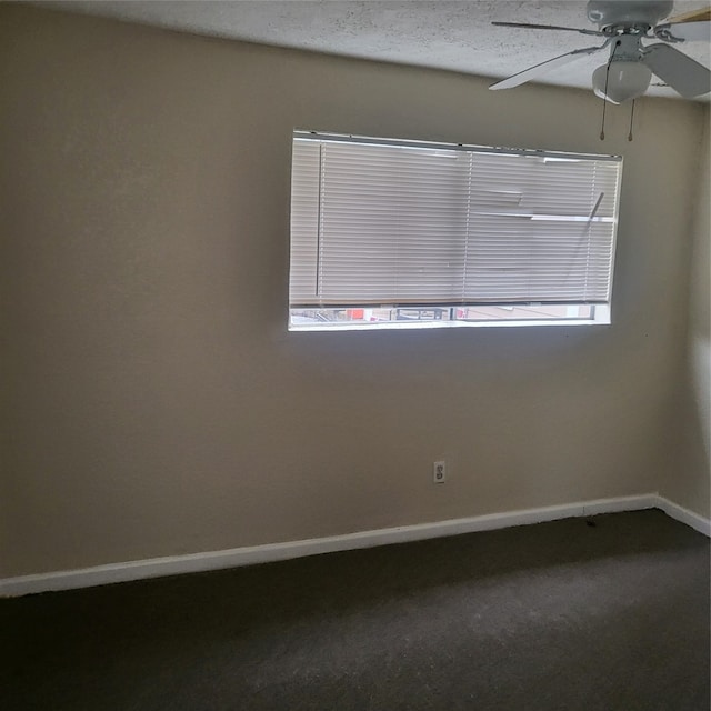 empty room with ceiling fan and carpet floors