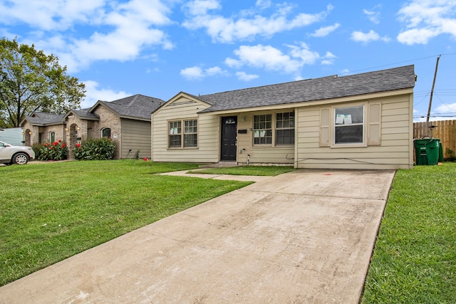 ranch-style home featuring a front yard