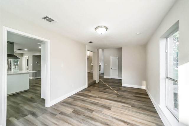 empty room featuring wood-type flooring