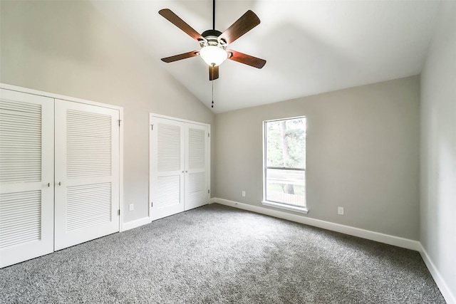 unfurnished bedroom featuring multiple closets, ceiling fan, and carpet flooring