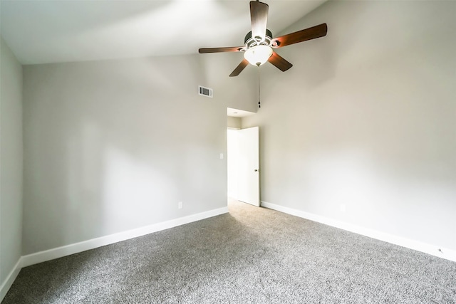 spare room featuring lofted ceiling, ceiling fan, and carpet floors