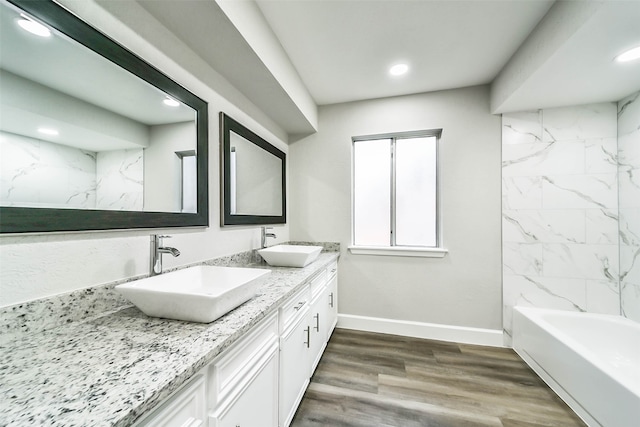 bathroom with vanity, hardwood / wood-style flooring, and separate shower and tub