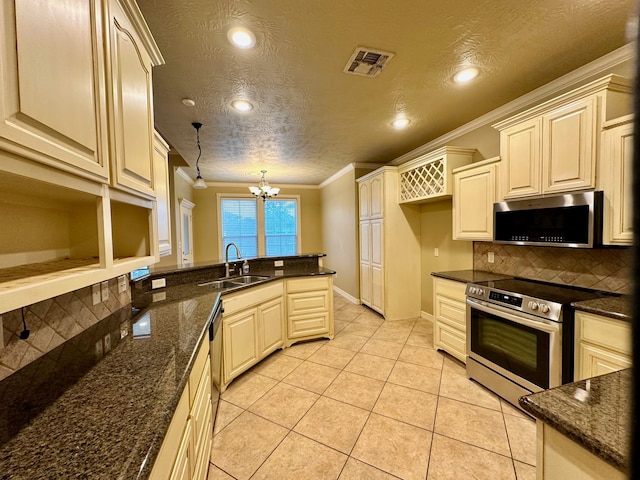 kitchen featuring light tile patterned floors, crown molding, stainless steel appliances, a chandelier, and sink