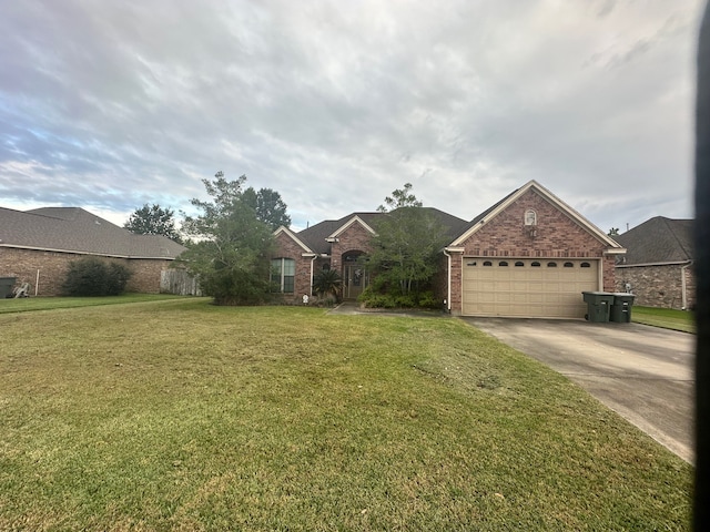 view of front of home featuring a garage and a front lawn