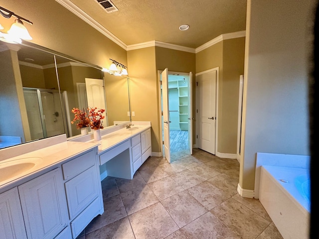 bathroom featuring crown molding, shower with separate bathtub, vanity, and a textured ceiling