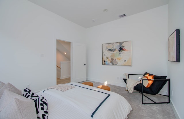 carpeted bedroom featuring lofted ceiling