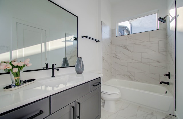 full bathroom with vanity, toilet, and tiled shower / bath