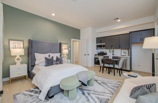 bedroom with light hardwood / wood-style flooring