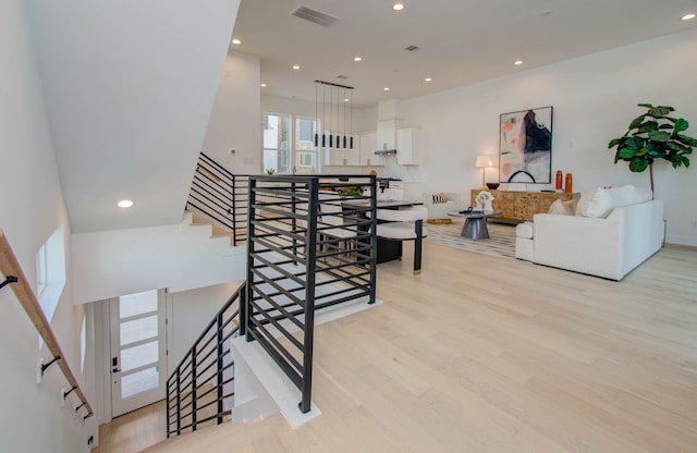 stairs with hardwood / wood-style floors