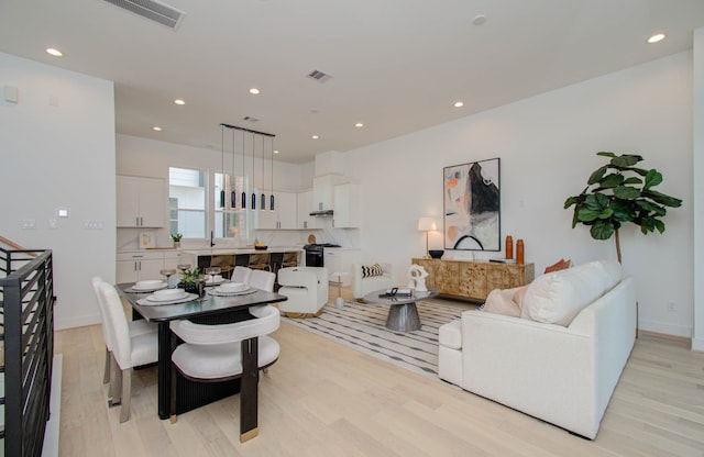 living room with light hardwood / wood-style floors