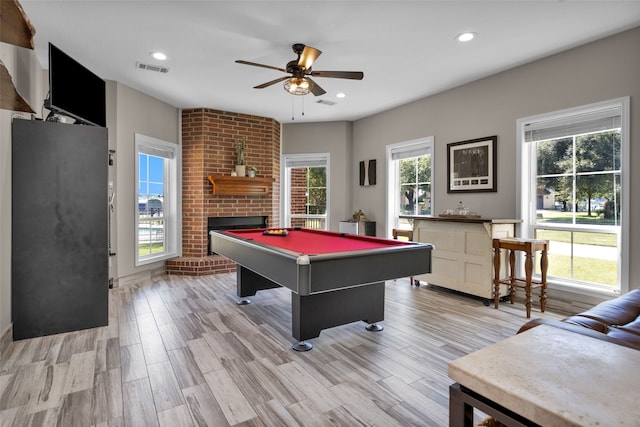 recreation room featuring light wood finished floors, pool table, visible vents, recessed lighting, and a fireplace