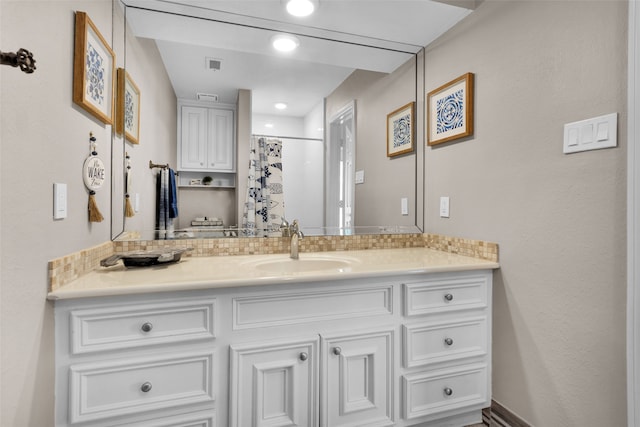 full bath featuring visible vents, vanity, and curtained shower